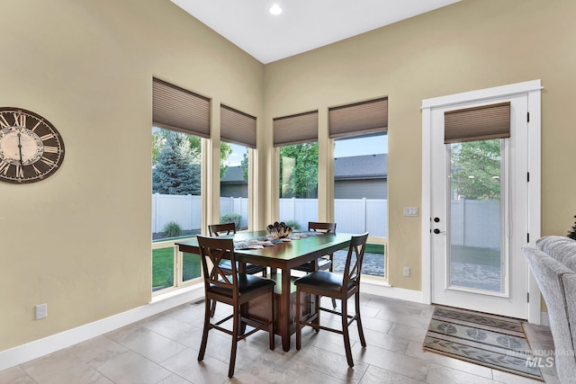 dining room with baseboards and recessed lighting