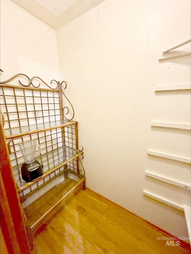 stairway featuring hardwood / wood-style flooring