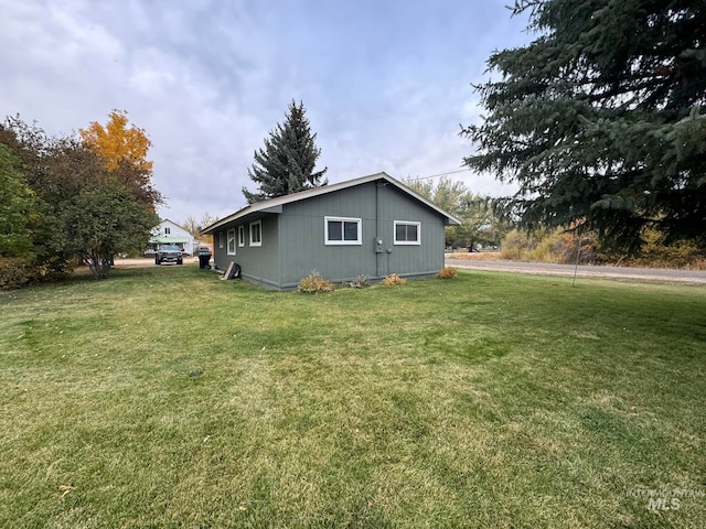 view of home's exterior with a yard