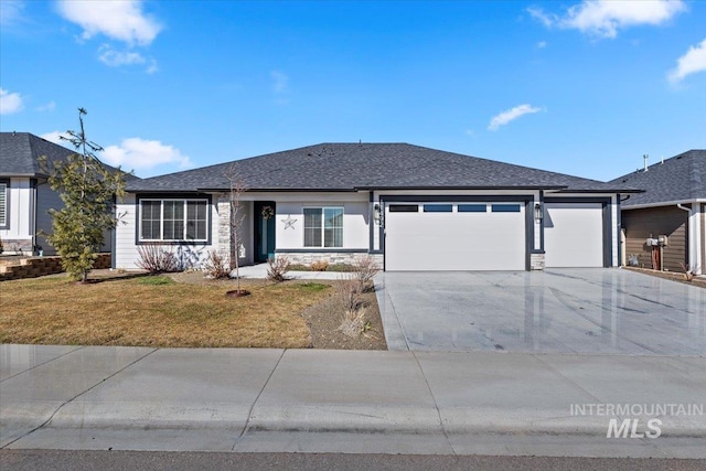 ranch-style house with roof with shingles, a garage, stone siding, driveway, and a front lawn