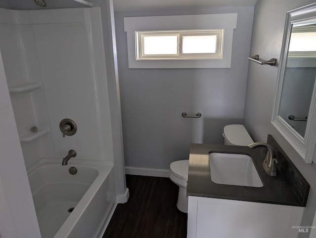 full bath featuring toilet, baseboards, a healthy amount of sunlight, and wood finished floors