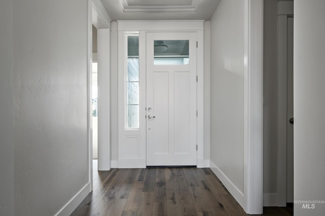 foyer featuring dark wood finished floors and baseboards