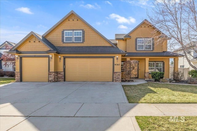 craftsman-style house featuring stone siding, concrete driveway, and a front lawn