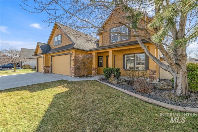 view of front facade with driveway, stone siding, roof with shingles, a front yard, and an attached garage