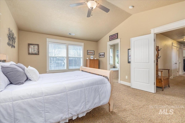 bedroom featuring visible vents, lofted ceiling, light colored carpet, and ceiling fan