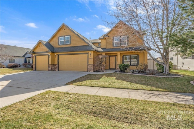 craftsman inspired home with stone siding, an attached garage, concrete driveway, and a front lawn