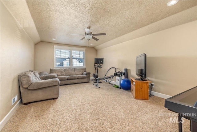 workout area with lofted ceiling, baseboards, visible vents, and carpet floors