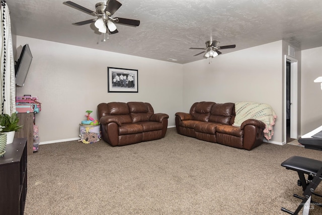 carpeted living room featuring a textured ceiling and ceiling fan