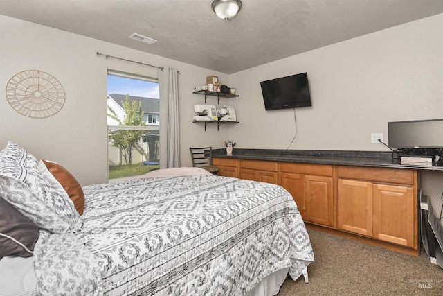 bedroom featuring a textured ceiling