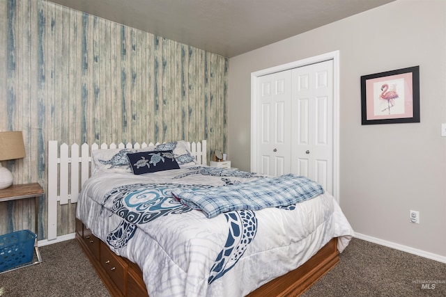 bedroom with dark colored carpet and a closet