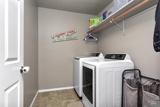 laundry room featuring washing machine and clothes dryer