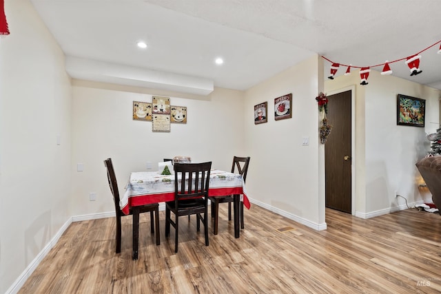 dining room with light hardwood / wood-style floors