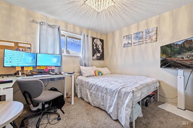 carpeted bedroom with a textured ceiling