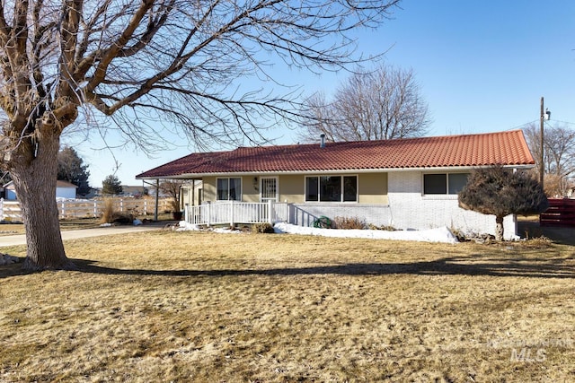 view of front of home featuring a front yard and a porch