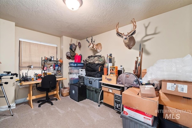 home office featuring carpet floors and a textured ceiling