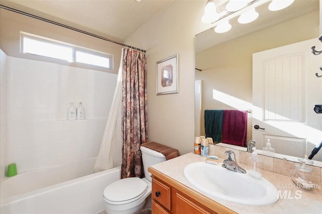 full bath with shower / bath combination with curtain, vanity, and toilet