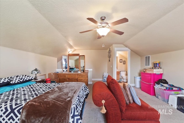 bedroom featuring lofted ceiling, visible vents, a textured ceiling, and carpet flooring