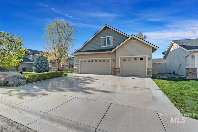 craftsman-style home with stone siding and concrete driveway