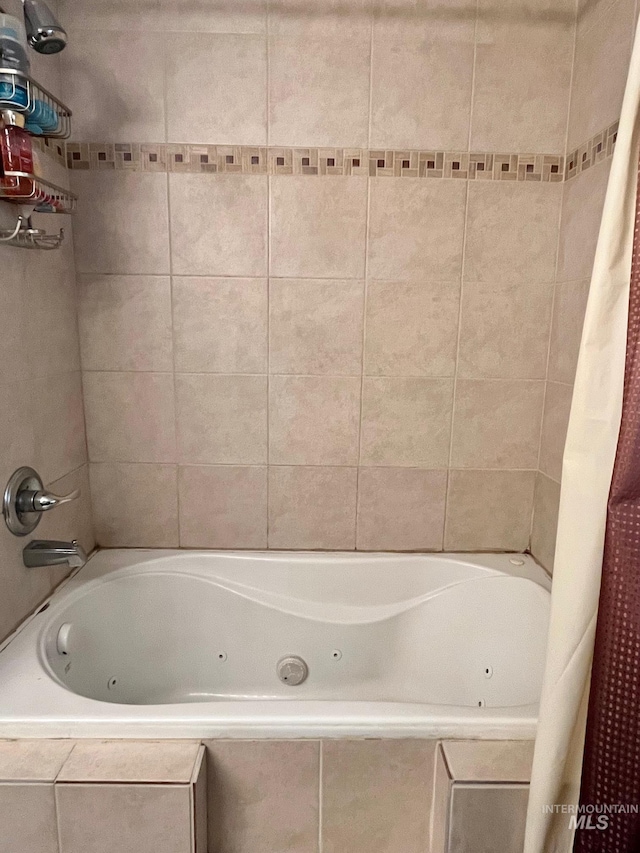 bathroom with shower / bathtub combination with curtain