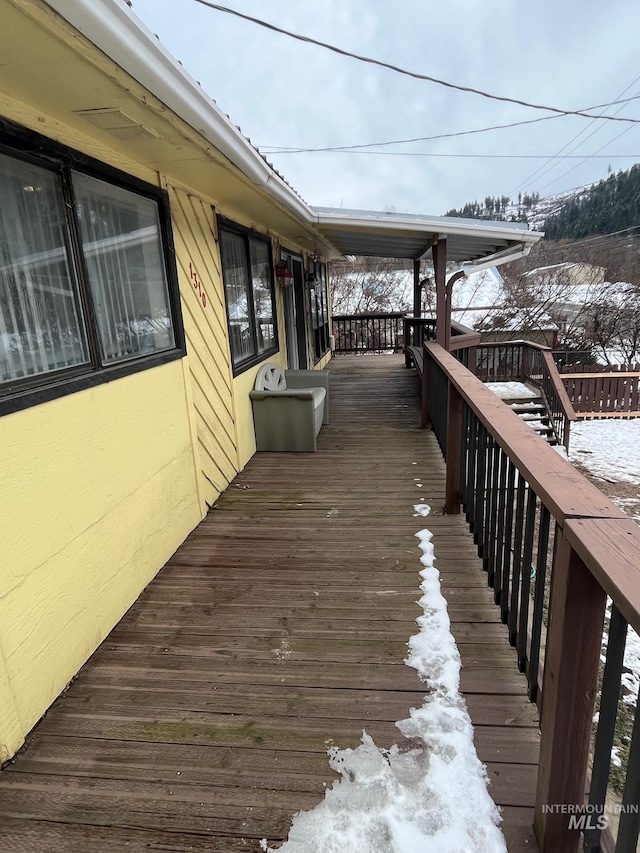 view of snow covered deck