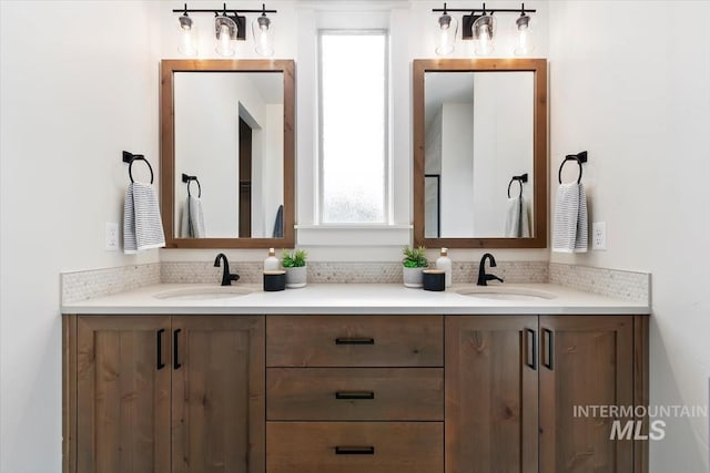 bathroom with double vanity and a sink