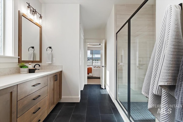 bathroom with vanity, ensuite bath, a stall shower, and tile patterned floors