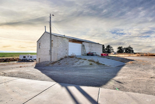 view of side of home featuring a garage