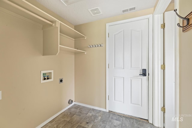 511 Bitterbrush Ave, Nampa, ID 83686 - laundry room with hookup for a washing machine, baseboards, electric dryer hookup, and stone finish floors