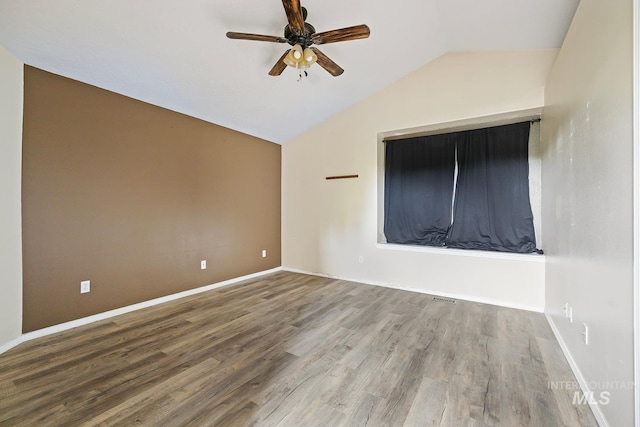 511 Bitterbrush Ave, Nampa, ID 83686 - spare room featuring ceiling fan, lofted ceiling, wood finished floors, and baseboards