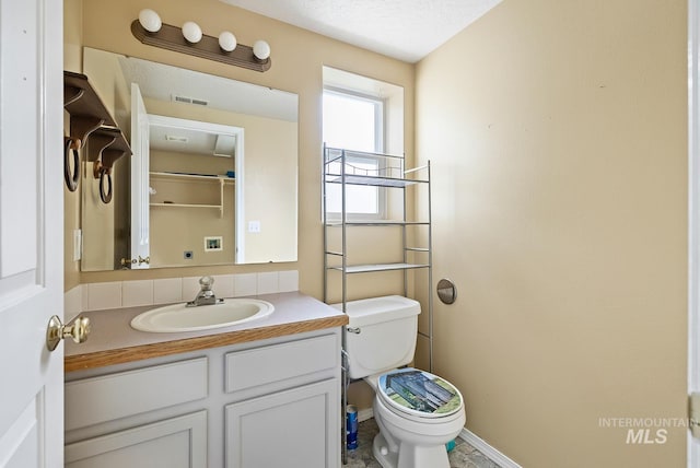 511 Bitterbrush Ave, Nampa, ID 83686 - half bath with toilet, vanity, and baseboards