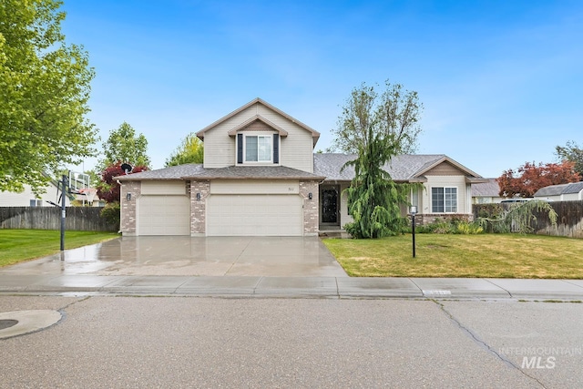 511 Bitterbrush Ave, Nampa, ID 83686 - traditional-style house with brick siding, concrete driveway, a shingled roof, a garage, and an attached garage