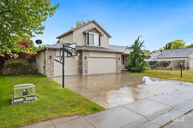 511 Bitterbrush Ave, Nampa, ID 83686 - view of front of home with brick siding, concrete driveway, and a garage