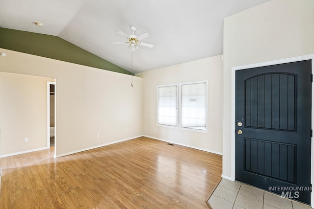 511 Bitterbrush Ave, Nampa, ID 83686 - entryway featuring a ceiling fan, light wood-type flooring, lofted ceiling, and baseboards