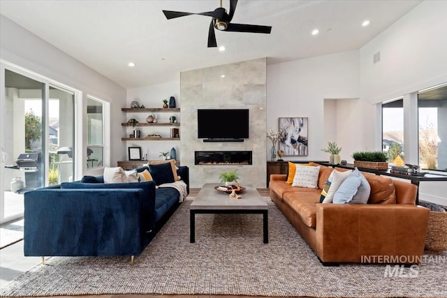 1889 W Winter Camp Ct, Boise, ID 83703 - living room with lofted ceiling, healthy amount of natural light, a ceiling fan, a tile fireplace, and recessed lighting