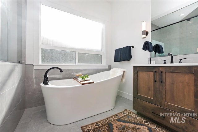 1889 W Winter Camp Ct, Boise, ID 83703 - full bath featuring vanity, a freestanding bath, tile patterned floors, and a shower