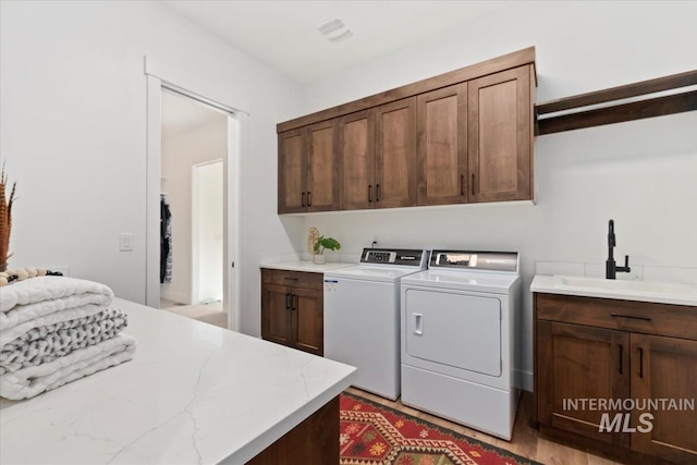 1889 W Winter Camp Ct, Boise, ID 83703 - washroom featuring cabinet space and washing machine and dryer