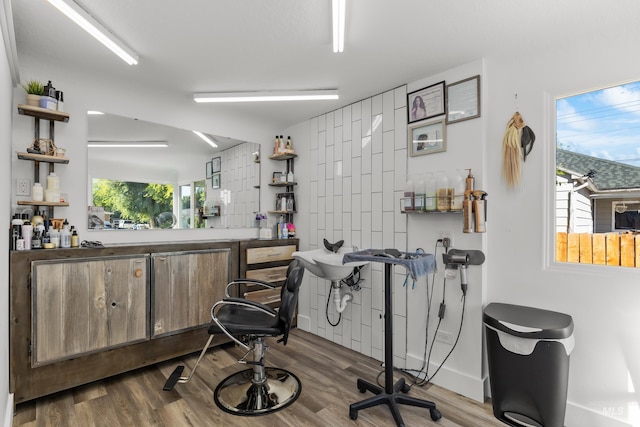interior space featuring wood finished floors and baseboards