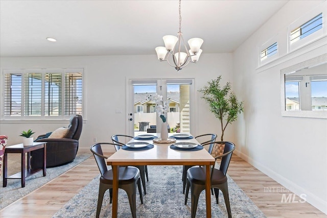 12740 S Alzano Way, Nampa, ID 83686 - dining room featuring plenty of natural light, a chandelier, light wood finished floors, and recessed lighting