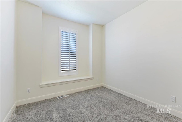 12740 S Alzano Way, Nampa, ID 83686 - carpeted empty room featuring baseboards and healthy amount of natural light