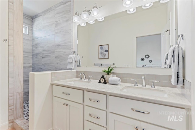 12740 S Alzano Way, Nampa, ID 83686 - full bathroom featuring double vanity, a walk in shower, and backsplash