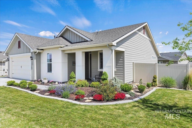 12740 S Alzano Way, Nampa, ID 83686 - view of front of home with board and batten siding, an attached garage, a shingled roof, and driveway