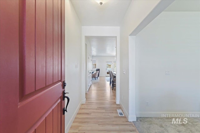 12740 S Alzano Way, Nampa, ID 83686 - foyer entrance with light wood-style floors and baseboards