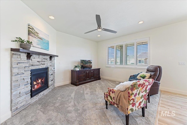 12740 S Alzano Way, Nampa, ID 83686 - living area with baseboards, a ceiling fan, a stone fireplace, and recessed lighting