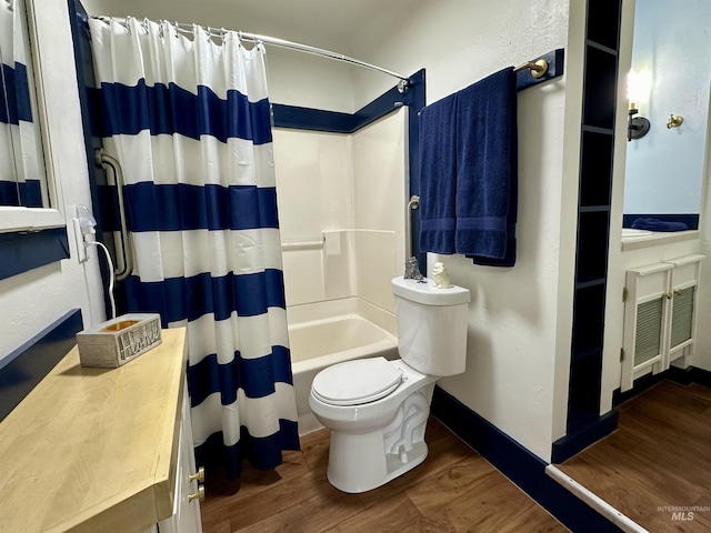 full bathroom with shower / bath combo, baseboards, visible vents, toilet, and wood finished floors