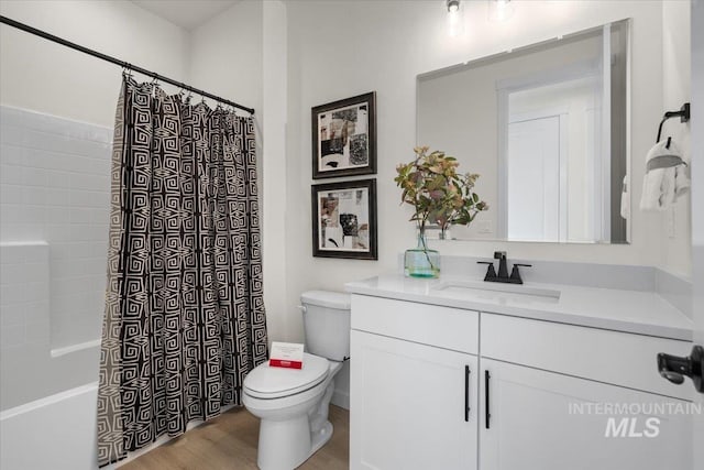 full bathroom with shower / bath combo, toilet, vanity, and wood finished floors