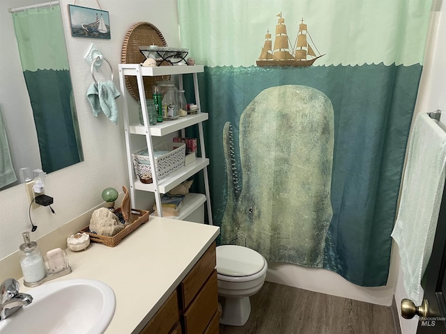 bathroom featuring vanity, hardwood / wood-style floors, and toilet