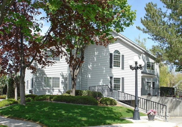 view of side of property featuring a yard