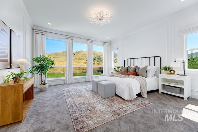 bedroom with carpet flooring and ornamental molding