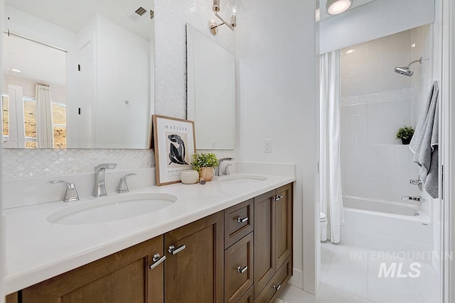 full bathroom featuring tile patterned floors, shower / tub combo, toilet, and dual bowl vanity