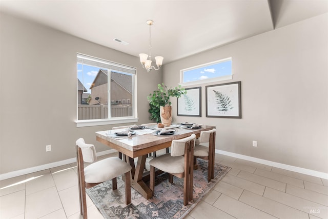 12457 W Awbrey St, Boise, ID 83709 - dining area featuring healthy amount of natural light, a chandelier, and light tile patterned flooring